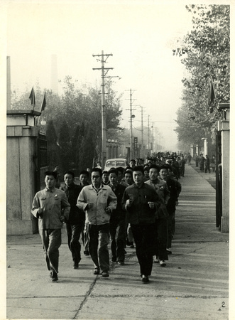Workers of a mechanical engineering company in Tianjin on an early morning run