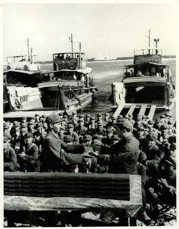 Soldiers one by one receiving their personal copy of Mao's writings (on Jinyin Island 金银岛)