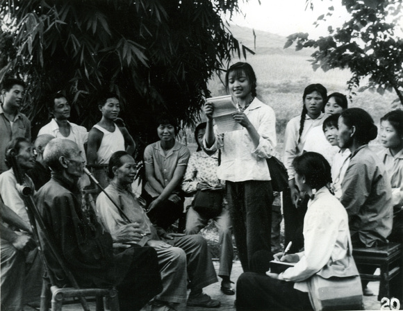 Second-year high school students reading their essays to members of a  commune in Dayi, Sichuan