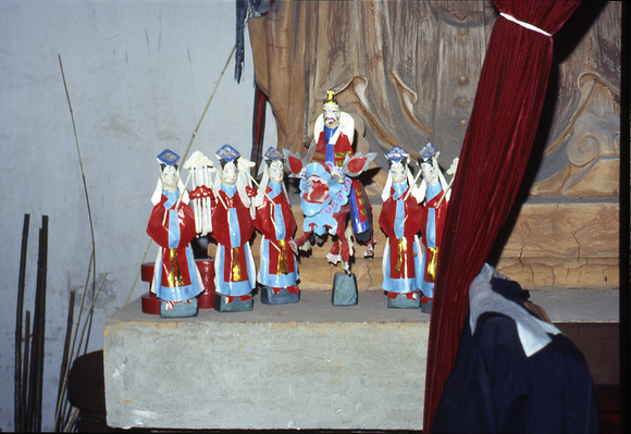 An arrangement of devotional paper-made deities inside the Grotto