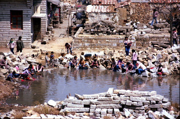 Washing clothes at the village pond