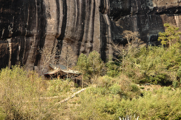Small cottage below a huge cliff (see next image)