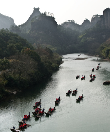 A flottilla of bamboo rafts floating down the Nine Bends River