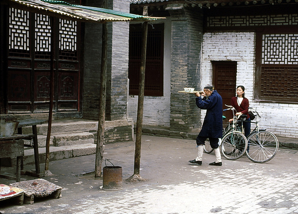 Old Daoist monk in the main courtyard