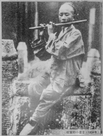 Daoist monk playing the flute (Bixiaci, Taishan, 1934)