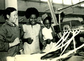 A member of the team from  Equatorial Guinea visiting a textile factory in Beijing