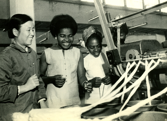 A member of the team from  Equatorial Guinea visiting a textile factory in Beijing
