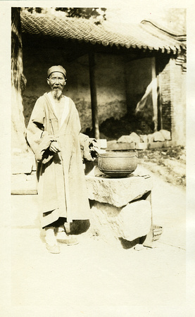 Daoist monk, tending to a wayside shrine, Taishan (1920s)