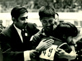 A Chinese player (刁文元) embraces his Pakistani counterpart, to whom he had just lost the match