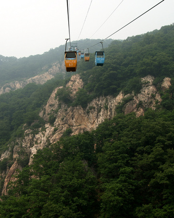 A silent and sturdy cable car connects the mountain's mid-section with the peak