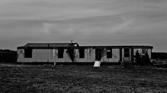 Another burnt-out and abandoned trailer home